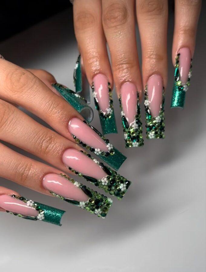 Long forest green nails adorned with delicate 3D flower embellishments. #longnails #forestgreennails #3dflowers