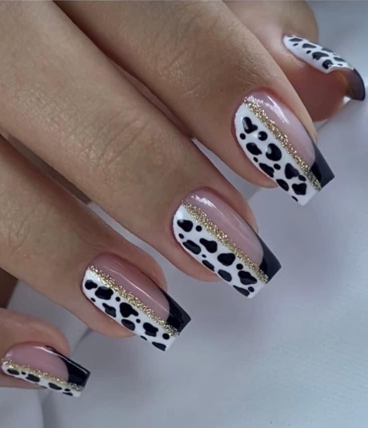 Fierce animal print nails with a baddie vibe, featuring bold leopard patterns in striking colors for a trendy and attention-grabbing nail idea.