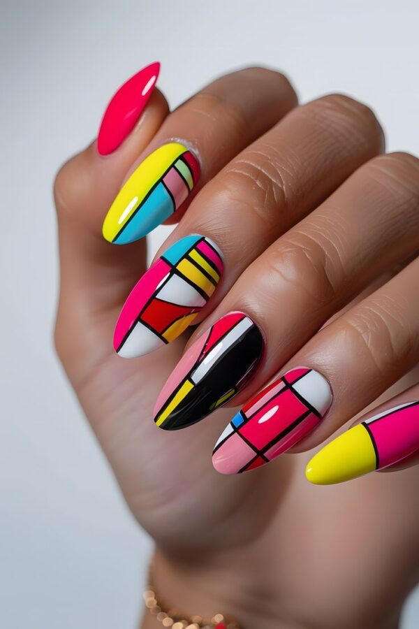 Modern geometric art nails featuring sharp lines, bold shapes, and contrasting colors, offering a sleek and artistic option for trendy baddie nail ideas.