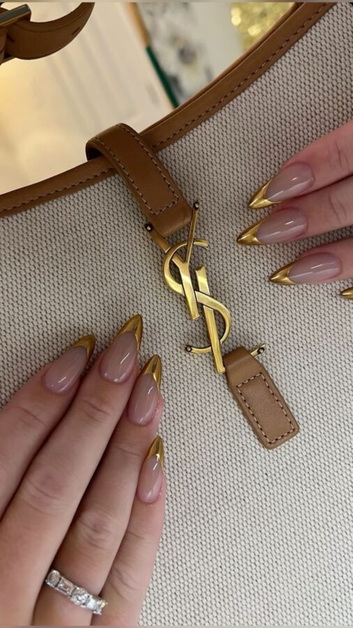  Luxurious and eye-catching: These gold foil French tip stiletto nails add a touch of opulence to a classic design.  A glamorous manicure for a special occasion. #GoldFoilNails #FrenchStilettoNails #StilettoNails #GlamNails #LuxuryNails #NailArt #SpecialOccasionNails