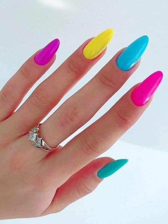 Vibrant neon pop nails in bold, electrifying colors, making a statement with their edgy and playful design, ideal for standout baddie nail ideas.