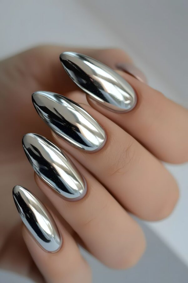 Striking silver chrome nails with a mirror-like finish, exuding bold glamour and futuristic vibes, perfect for standout baddie nail ideas.