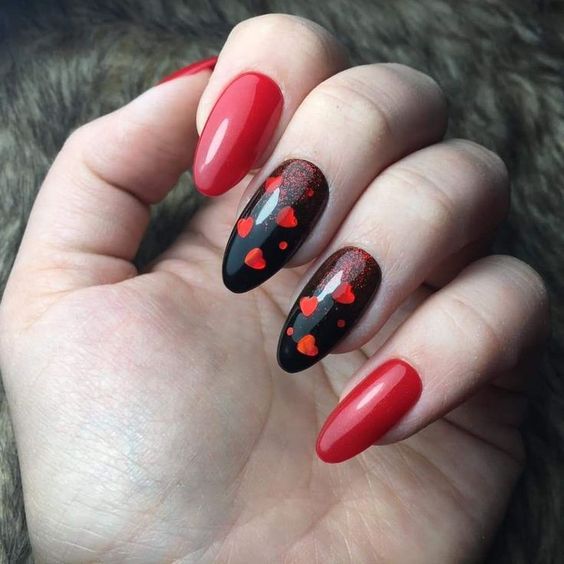 Bold and edgy Valentine's Day nails featuring a striking combination of black and red.