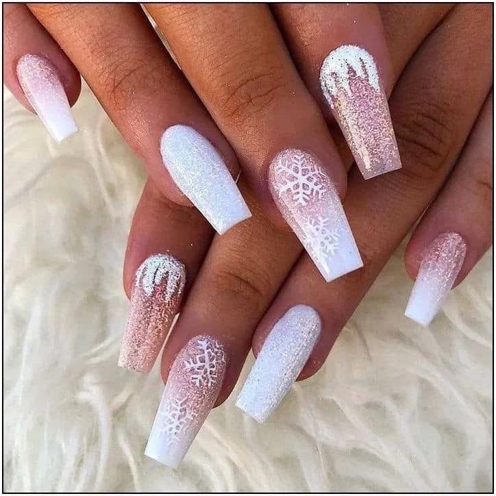 A classic French manicure with a modern twist, featuring intricate decorative details.