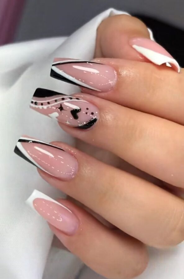 A hand showcases nails with intricate line art designs, a minimalist and chic geometric nail art style. #LineArtNails #GeometricNailArt #MinimalistNails #ChicDesign