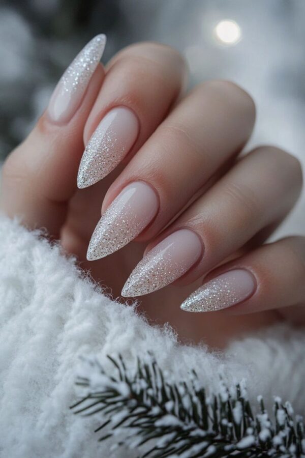 Sparkling white nails with a touch of glitter, perfect for adding a touch of festive magic.