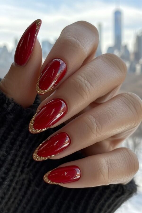 Sparkling Valentine's Day nails with a glamorous combination of glittery red and gold.