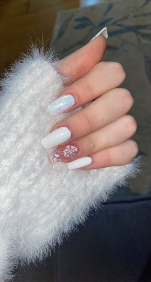 Festive nails with a winter white design, perfect for the holiday season.