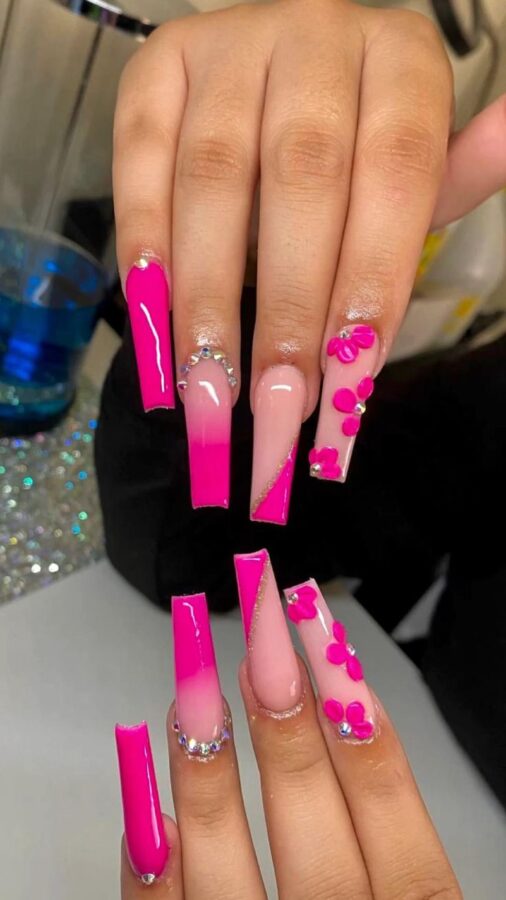 Make a statement with these long, hot pink hybrid nails. This vibrant and glossy manicure is perfect for adding a touch of bold color to your look. #LongNails #HotPinkNails #HybridNails #GlossyNails #BoldNails