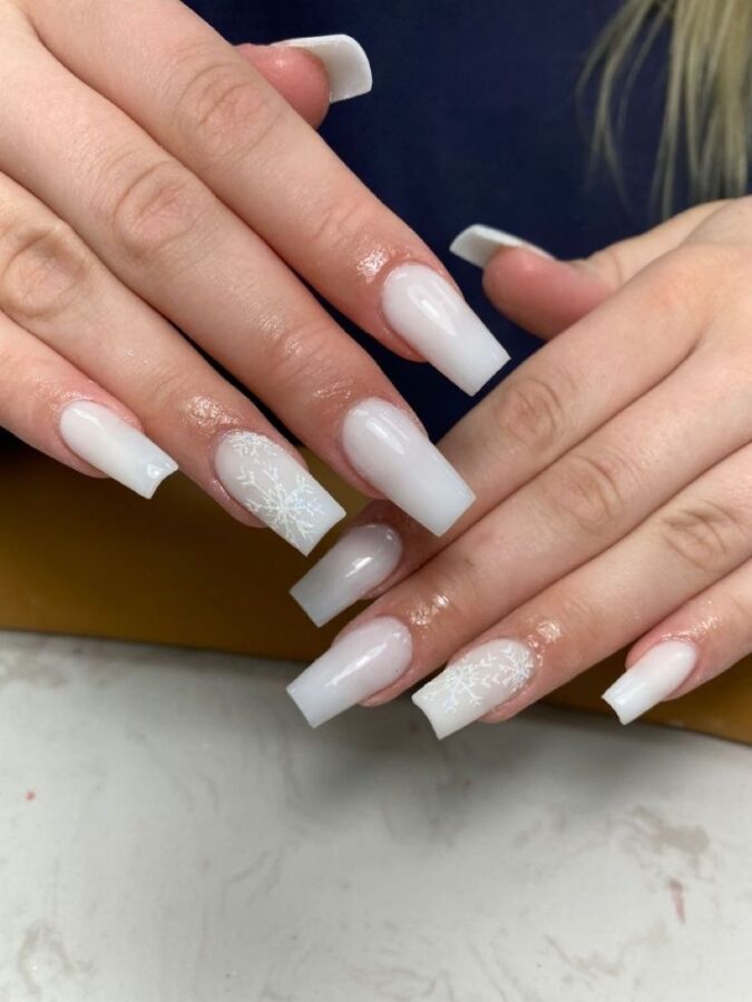 elegant nails featuring a classic French tip with a soft and subtle milky white polish.