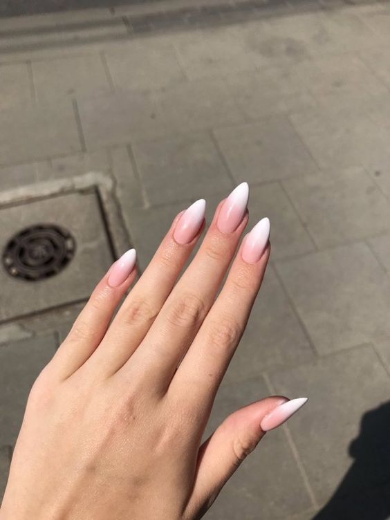 A soft and romantic ombré manicure in shades of pink and white.