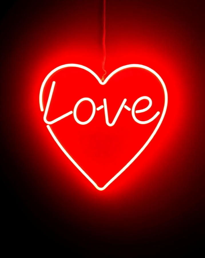 A romantic Valentine's Day wallpaper featuring a vibrant neon sign.