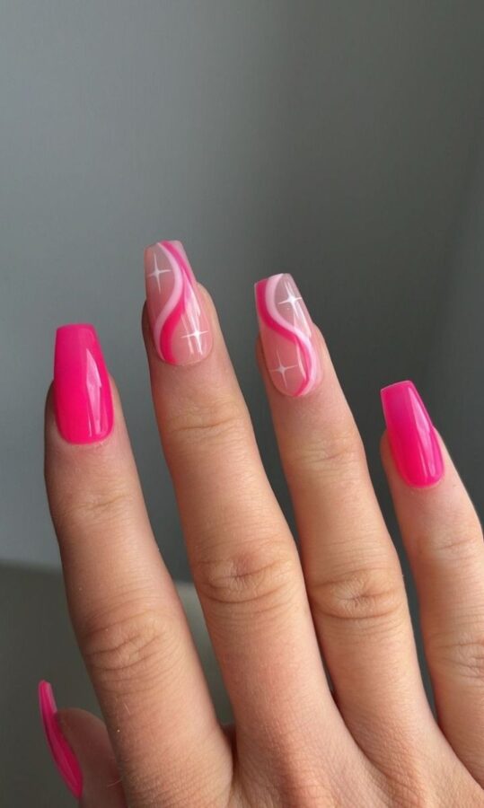 Groovy baby! These swirl pink nails feature a mesmerizing, abstract design.  Perfect for adding a touch of fun and color to your style. #SwirlNails #PinkNails #NailArt #AbstractNails #TrendyNails