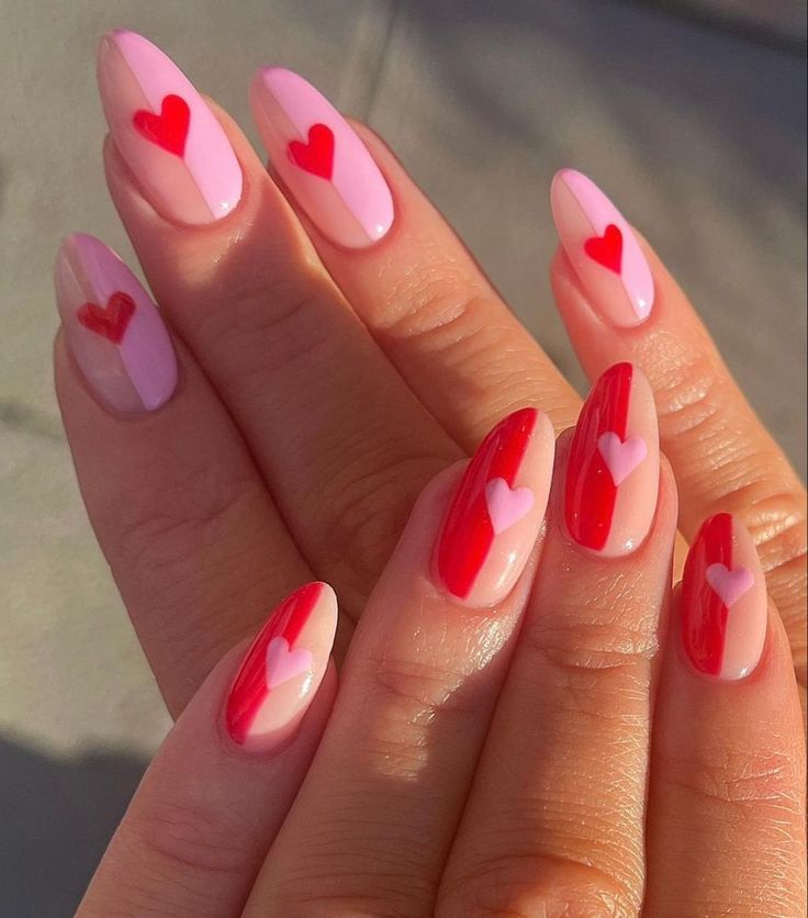 Delicate pastel nails adorned with tiny hearts.