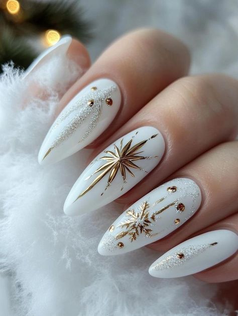 A close-up of elegant nails featuring a luxurious combination of white and gold, perfect for a touch of winter glamour.