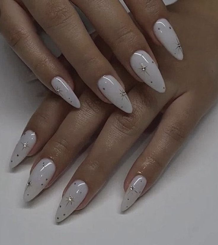 Stunning pearlescent white nails, adding a touch of winter sparkle.