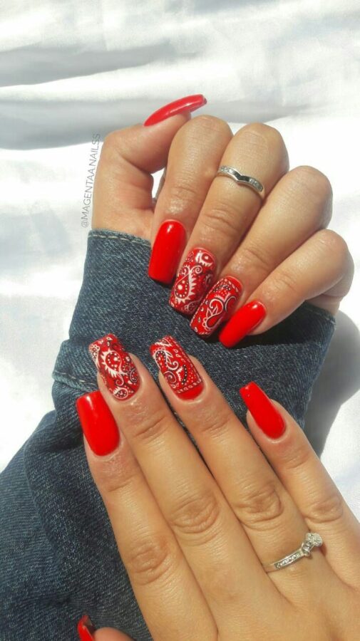 Embrace a Western-inspired look with this bandana pattern nail art. #westernnaildesigns #bandanastyle #nailart