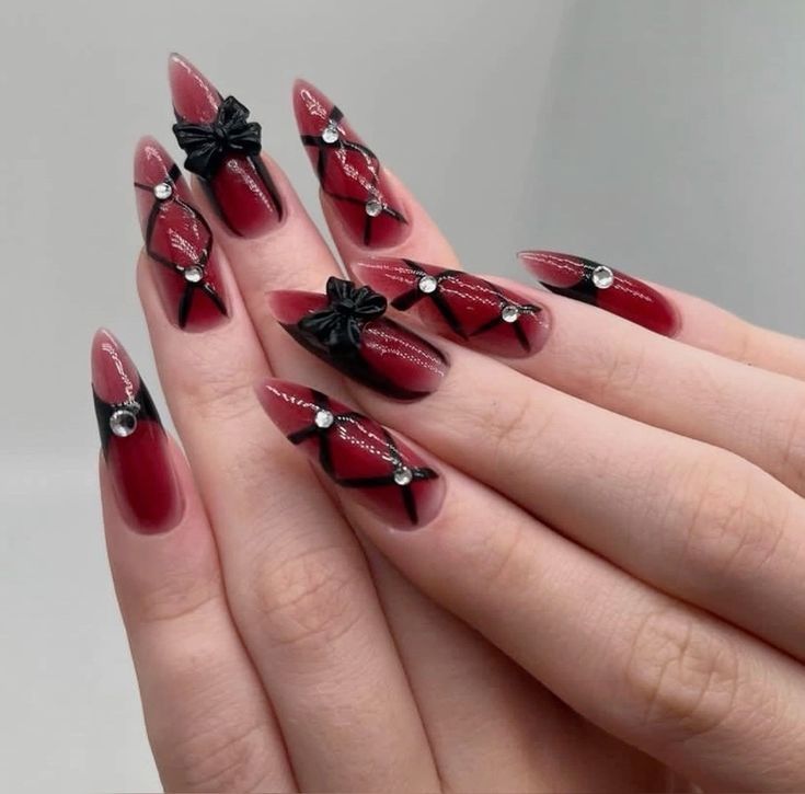 Make a dramatic statement on your birthday with these bold red nails featuring striking black accents. 