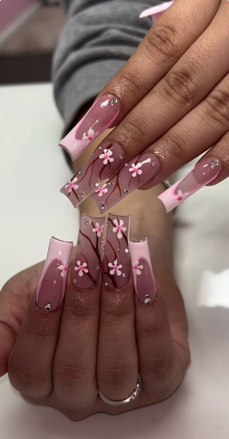 Celebrate the beauty of spring with these delicate and charming cherry blossom nails. #CherryBlossomNails  #FloralNails #SpringBeauty