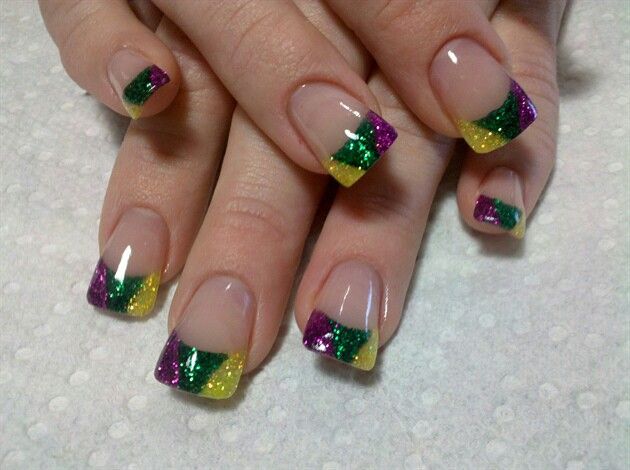 Celebrate Mardi Gras with these vibrant nails featuring classic purple, green, and gold color blocks. 