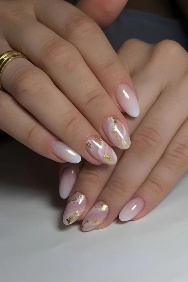 Add a touch of unique artistry to your wedding day with these stunning marble nail designs. #MarbleNails #UniqueNails 