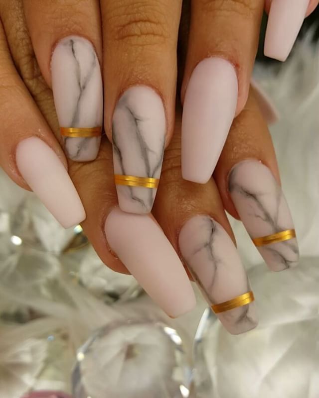 This image highlights the delicate veining in a matte marble nail art design, mimicking the natural patterns of marble stone. #mattemarbleveins #marbledetail #nailartinspo