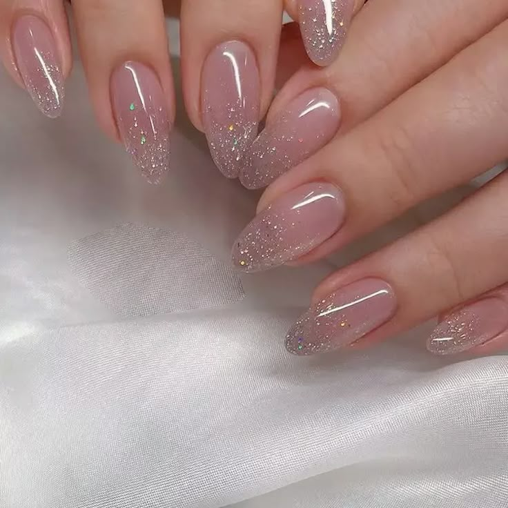 These nude nails with a touch of glitter offer a sophisticated and understated birthday look.