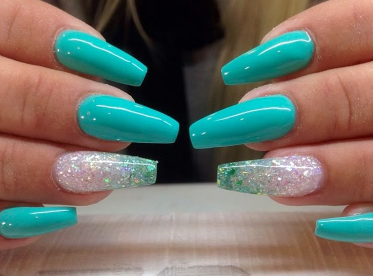 This image showcases nails painted with turquoise and silver accents, a stylish Western nail design. #westernnaildesignideas #turquoisemanicure #silveraccents