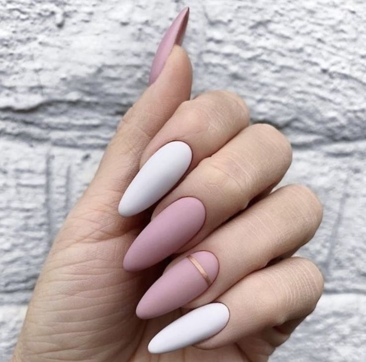 This image showcases a set of nails with a stylish two-tone design in a matte finish. #mattemanicure #twotone #naildesign