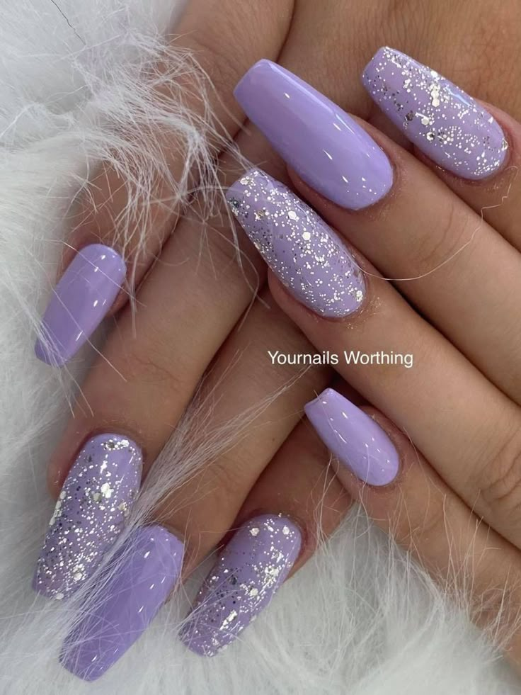 Embrace the sparkle of spring with these fun and glittery lilac nails. #GlitteryLilacNails #LilacNails #SparklyNails